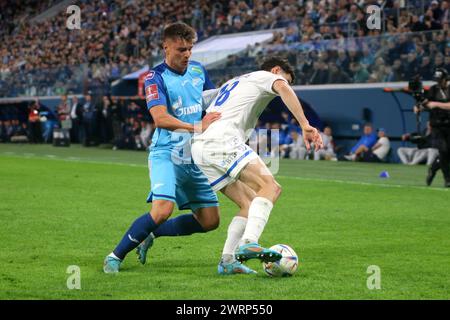 Saint-Pétersbourg, Russie. 13 mars 2024. Andrey Mostovoy (17 ans) de Zenit et Nicholas Marichal Perez (18 ans) de Dynamo vus en action lors du match de football de la Coupe de Russie 2023/2024 entre Zenit Saint-Pétersbourg et Krylia Dynamo Moscou à Gazprom Arena. Score final ; Zenit 2:0 Dynamo. (Photo de Maksim Konstantinov/SOPA images/SIPA USA) crédit : SIPA USA/Alamy Live News Banque D'Images