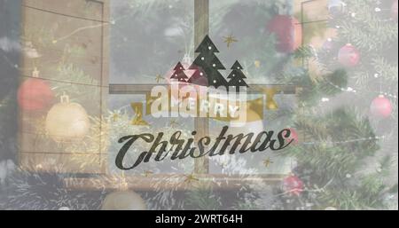 Image du texte de voeux de noël sur l'arbre de noël et les décorations Banque D'Images