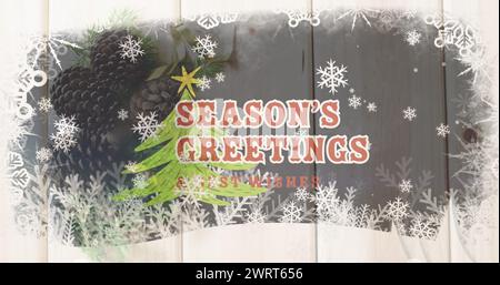Image du texte de voeux de noël sur l'arbre de noël et les décorations Banque D'Images