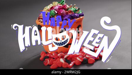 Image du texte Happy halloween sur seau de citrouille orange avec des bonbons Banque D'Images
