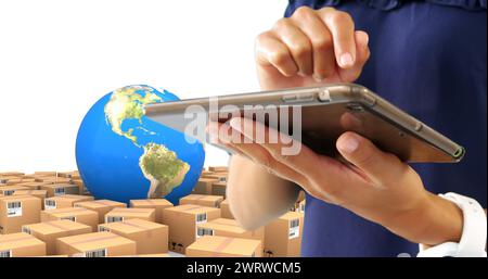 Image de l'homme utilisant la tablette avec des piles de boîtes et globe sur fond blanc Banque D'Images