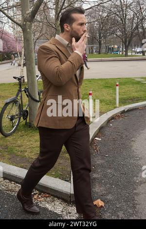 Bucarest, Roumanie. 15 mars 2024 : Tristan Tate et son frère Andrew Tate (absent de la photo) partent après une audience dans leur procès à la Cour de Bucarest. Crédit : Lucian Alecu/Alamy Live News Banque D'Images