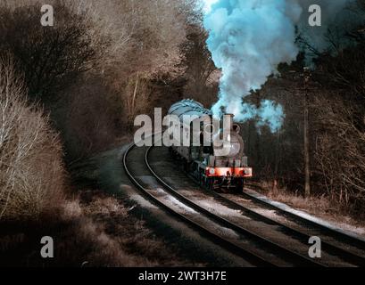 Trains à vapeur en mouvement et avec de la vapeur circulant sur le chemin de fer Great Central Banque D'Images