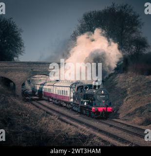 Trains à vapeur en mouvement et avec de la vapeur circulant sur le chemin de fer Great Central Banque D'Images