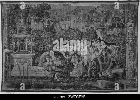 Rêve de Paris. Inconnu c. 1530 dimensions de tapisserie : H 10'2' x l 15'3' matériaux / techniques de tapisserie : inconnu culture : Centre de tissage flamand : inconnu histoire de propriété : Français et Co. Inscriptions : inscription dans le champ central sur la plaque sur la fontaine : inscriptions GREVSA : inscription dans le champ central sur la plaque à côté du Paris endormi : inscriptions PARIS : inscription dans le champ central sur la plaque tenue par la femme à côté de Paris : inscriptions EMOME : inscription dans le champ central sur les plaques en haut à droite de la scène: PARIS, EMOME dans le paysage, Paris, les yeux fermés, s'assoit sur les marches de la fontaine décorative (l) comme femme Banque D'Images