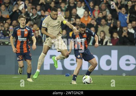 Kylian Mbappe du PSG, Jordan Ferri de Montpellier lors du match de championnat de France de Ligue 1 entre Montpellier HSC (MHSC) et Paris Saint-Germain (PSG) le 17 mars 2024 au stade la Mosson de Montpellier, France Banque D'Images