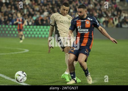 Kylian Mbappe du PSG, Jordan Ferri de Montpellier lors du match de championnat de France de Ligue 1 entre Montpellier HSC (MHSC) et Paris Saint-Germain (PSG) le 17 mars 2024 au stade la Mosson de Montpellier, France Banque D'Images