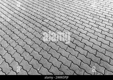 Fond gris de carrelage de route en béton, motif de dalles de pavage Banque D'Images