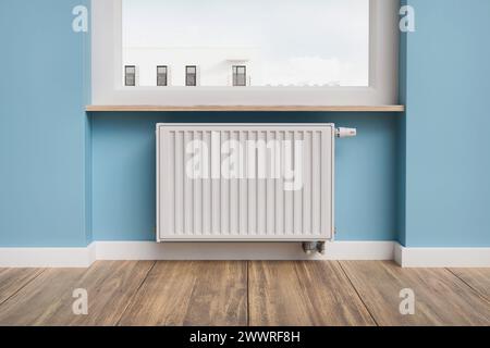 Radiateur de chauffage de panneau de maison commun installé sous la fenêtre - rendu 3D. Banque D'Images