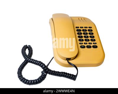 Altes analogues Tastentelefon mit Telefonhörer und Ringelkabel isoliert auf Weiß. Banque D'Images