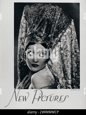 Portrait de Joan Crawford en chapeau espagnol fantaisie. Vintage Photoplay Magazine portrait de l'actrice de cinéma par la photographe Ruth Harriet Louise. circa 1928 Banque D'Images