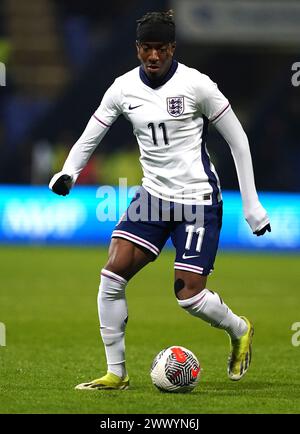 L'anglaise Noni Madueke en action lors du match de qualification du groupe F pour le Championnat UEFA Euro U21 au Toughsheet Community Stadium, Horwich. Date de la photo : mardi 26 mars 2024. Banque D'Images