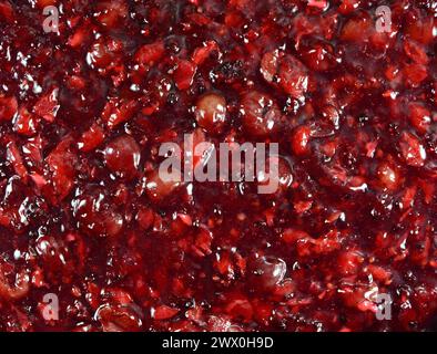 Garniture de gelée aux cerises rouges. Texture de garniture de gelée de cerises rouges. Texture de surface du gâteau au fromage. Gros plan. Banque D'Images