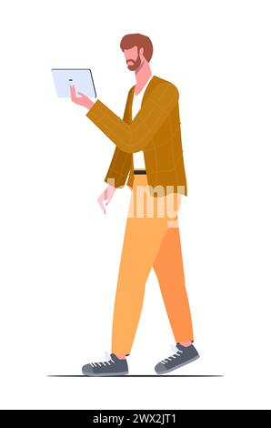 Jeune homme dans des vêtements décontractés modernes avec une tablette à la main. Illustration vectorielle dans un style plat. Banque D'Images