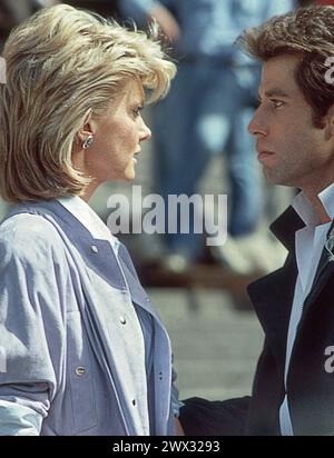 John Travolta et Olivia Newton John sur un plateau de cinéma de 'Two of a Kind' à Manhattan, 1983. Banque D'Images