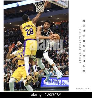 Pékin, États-Unis. 26 mars 2024. Giannis Antetokounmpo des Milwaukee Bucks est défendu par Rui Hachimura des Los Angeles Lakers lors du match de saison régulière entre les Los Angeles Lakers et les Milwaukee Bucks à Milwaukee, États-Unis, le 26 mars 2024. Crédit : Joel Lerner/Xinhua/Alamy Live News Banque D'Images