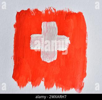 Sur une feuille blanche, un dessin a été dessiné avec des aquarelles qui ressemblent au drapeau de la Suisse. Banque D'Images