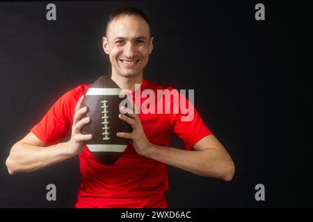 Un joueur de rugby, isolé sur noir Banque D'Images