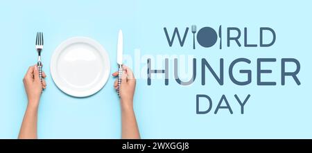 Bannière pour la Journée mondiale de la faim avec femme à table avec assiette vide Banque D'Images