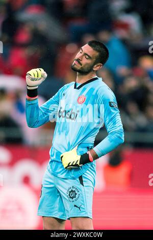 Gérone, Espagne. 31 mars 2024. Paulo Gazzaniga, gardien du Girona FC, célèbre le premier score de son coéquipier Artem Dovbyk lors du match de football de la ligue espagnole (la Liga) entre le Girona FC et le Real Betis au stade Montilivi, Gérone, Espagne, le 31 mars 2024. Crédit : Joan Gosa/Xinhua/Alamy Live News Banque D'Images