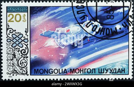 Timbre-poste annulé imprimé par la Mongolie, qui promeut la recherche spatiale. Banque D'Images