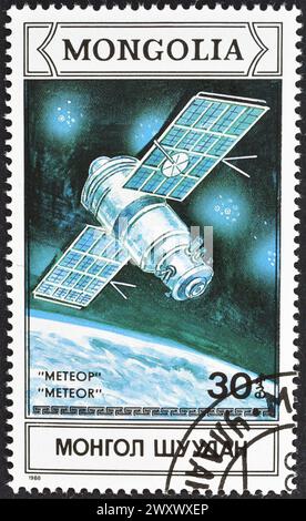Timbre-poste annulé imprimé par la Mongolie, qui promeut la recherche spatiale. Banque D'Images