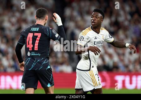 Madrid, Espagne. 09th Apr, 2024. Vinicius Junior du Real Madrid se dispute avec Phil Foden de Manchester City lors du match quart de finale de l'UEFA Champions League entre le Real Madrid CF et Manchester City à l'Estadio Santiago Bernabeu le 9 avril 2024 à Madrid, en Espagne. (Photo de Gerard Franco/Dax images) crédit : DAX images/Alamy Live News Banque D'Images