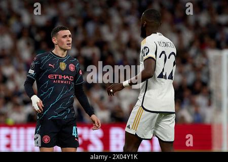 Madrid, Espagne. 09th Apr, 2024. Phil Foden de Manchester City se dispute avec Antonio Rudiger du Real Madrid lors du match quart de finale de l'UEFA Champions League entre le Real Madrid CF et Manchester City à l'Estadio Santiago Bernabeu le 9 avril 2024 à Madrid, en Espagne. (Photo de Gerard Franco/Dax images) crédit : DAX images/Alamy Live News Banque D'Images