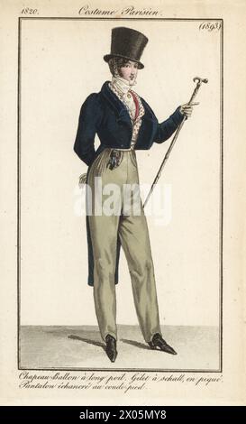 Gentleman français en haut-de-forme avec poil épais, blouse bleue, gilet piqué, pantalon longueur cheville, tenant une canne. Chapeau-ballon a long poil, gilet a schall en pique, pantalon echancre au coude-pied. Gravure sur cuivre colorée à la main d’après une plaque mode de Louis Marie Lante du Journal des Dames et des modes de Pierre de la Mesangère, Magazine of Women and Fashion, Paris, 1820. Banque D'Images