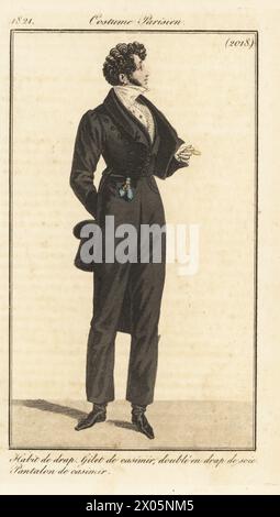 Dandy français en tailcoat doublé de soie, gilet peigné et pantalon, tenant un haut-de-forme et monocle. Habit de drap, gilet de casimir, double en drap de soie, pantalon de casimir. Gravure sur cuivre colorée à la main d’après une plaque mode de Louis Marie Lante du Journal des Dames et des modes de Pierre de la Mesangère, Magazine of Women and Fashion, Paris, 1821. Banque D'Images