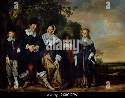 Groupe familial dans un paysage par le peintre Frans Hals (v. 1582 –1666) - Haarlem, pays-Bas, 17ème siècle, âge d'or néerlandais ( les parents au centre, se tenant la main et se regardant, sont l'image même du bonheur conjugal. Remarquez les détails blancs de la dentelle sur leurs vêtements, à la mode de l'époque. ) ( Il peignait des portraits vivants, parfois même joyeux, de gens de tous les niveaux de la société, de gens importants, d'enfants méchants et même d'ivrognes ou de gens qui avaient été déclarés fous. ) Banque D'Images