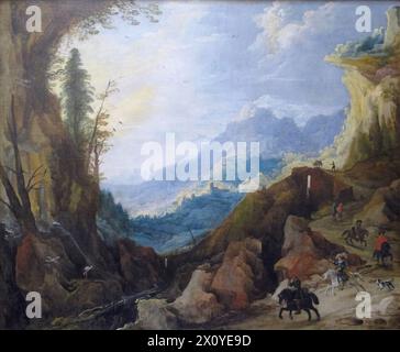 Paysage montagneux avec un pont et quatre cavaliers est une peinture à l'huile sur toile du paysagiste flamand Joos de Momper. Banque D'Images