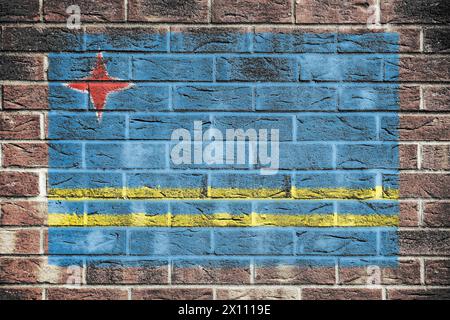 Drapeau d'Aruba sur un fond de mur de briques Banque D'Images