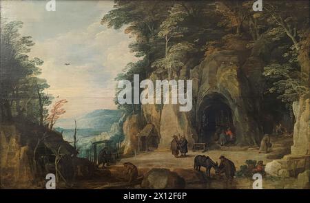 Paysage montagneux avec un pont et quatre cavaliers (Ermitage de moines dans une grotte) est une peinture à l'huile sur panneau du peintre flamand Joos de Momper. Banque D'Images