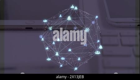 Image d'un réseau de connexions avec des icônes flottant au-dessus d'un bureau avec un ordinateur portable, une tablette et un smartphone Banque D'Images