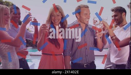 Image de confettis sur des amis heureux et divers avec des boissons Banque D'Images