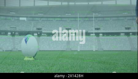 Image du traitement des données et du balayage d'oscilloscope au-dessus d'un joueur de rugby afro-américain au stade Banque D'Images