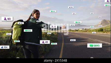 Image de plusieurs barres de notification au-dessus d'une femme biraciale soulevant l'arrêt pour prendre l'ascenseur à l'autoroute Banque D'Images