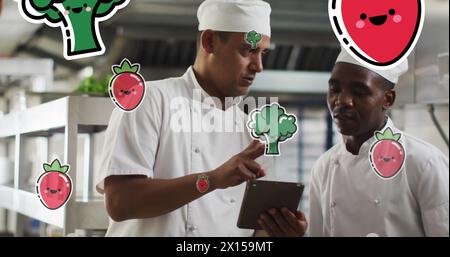 Image des icônes de légumes et de fruits sur divers chefs utilisant la tablette Banque D'Images