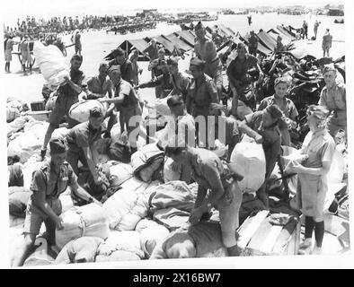 BRIGADE POLONAISE INDÉPENDANTE DES CARPATES EN PALESTINE, 1940 - soldats de la brigade polonaise indépendante des Carpates déchargeant leur équipement et leur équipement à leur arrivée sur leur site de campement. Les Polonais ont rejoint les Britanniques seulement 5 jours plus tôt après que le général Eugène Mittelhauser, commandant des forces françaises en Syrie dont la Brigade faisait partie, ait décidé de soutenir le régime de Vichy. Photographie prise dans le village de Samakh le long de la mer de Galilée Armée polonaise, Forces armées polonaises à l'Ouest, Brigade indépendante des Carpates Banque D'Images