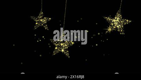 Image de points sur des étoiles dorées sur fond noir Banque D'Images