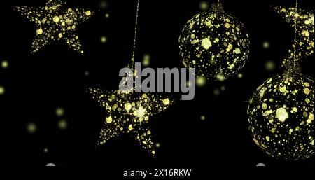 Image de points flottant sur des étoiles dorées et des boules sur fond noir Banque D'Images