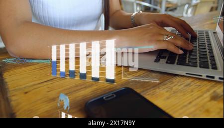 Image de graphiques, globes, langage informatique, section médiane de femme caucasienne travaillant sur ordinateur portable Banque D'Images