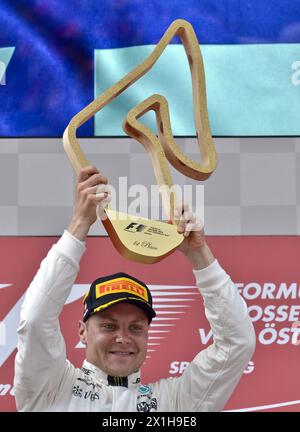 The Formula One Grand Prix of Austria at Red Bull Ring on July 9, 2017 in Spielberg, Austria. PICTURE:   Valtteri Bottas (FIN, Mercedes AMG Petronas F1 Team) celebrates on podium - 20170709 PD2404 - Rechteinfo: Rights Managed (RM) Stock Photo