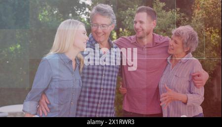 Famille caucasienne avec jeunes adultes et adultes matures appréciant le temps ensemble Banque D'Images