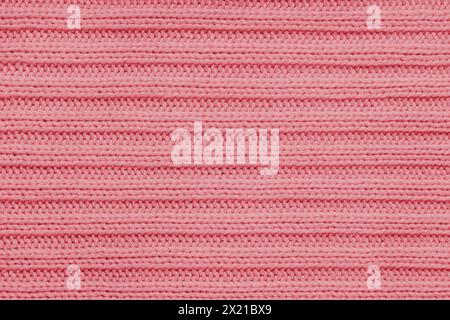 Fond textile Jersey , tricot rayé rouge. Tricot en laine, pull, texture de surface de pull, structure textile, surface de tissu, tissage Banque D'Images