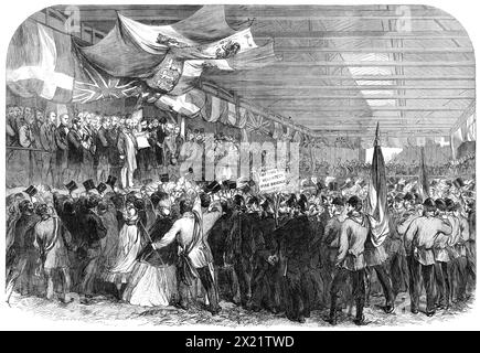 Garibaldi en Angleterre : Garibaldi reçoit une adresse à la gare des Nine Elms, 1864. Vue de '...l'intérieur du hangar de grande marchandise à la gare Nine Elms du London and South-Western Railway, dans l'après-midi du lundi 11 avril, quand Garibaldi venait d'arriver de Southampton, et recevait les adresses du comité municipal, du comité des travailleurs, et le Comité des Italiens résidant à Londres'. Tiré de "Illustrated London News", 1864. Banque D'Images