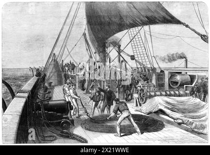 The Atlantic Telegraph Expedition : se préparer à la dernière tentative d'accrocher le câble perdu - d'après un croquis de notre artiste spécial, 1865. 'Notre illustration montre un groupe d'hommes sur le pont, près de l'extrémité proue du navire, arrangeant les bobines de corde avant d'abaisser le grappin pour la dernière fois, le 11 août. Il avait été abaissé la veille, mais n'avait pas réussi à attraper le câble. La corde et le grappin ayant été ramenés le lendemain matin, des préparatifs ont été faits pour la prochaine et dernière tentative. Tiré de "Illustrated London News", 1865. Banque D'Images