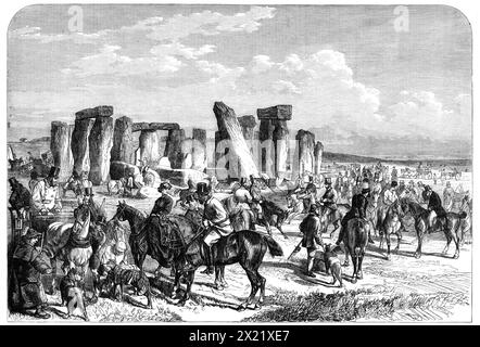 Réunion de courtisane du Wiltshire Champion à Stonehenge, 1865. Gravure d'un croquis de Mr. G. B. Goddard, représentant '...le lieu de tritching pour les courseurs un ou deux matins pendant la "semaine des champions". Stonehenge, cette pile d'ambres ou de pierres saintes, est un grand mystère. Certains affirment qu'ils ont été amenés par Merlin de la côte de Scythie par le grand Pendragon, et d'autres qu'ils ont été élevés par des chefs danois en l'honneur de l'idole de la victoire. Quoi qu'il en soit, les bergers et les coursiers [lièvre] les partagent maintenant... la récente réunion a été très bien suivie, et neuf enjeux nous Banque D'Images