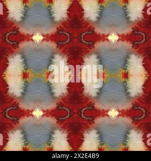 Motif sans couture à l'aquarelle teinte au noeud. Imprimé ikat sans fin dessiné à la main dans des couleurs terreuses. Ornement traditionnel tribal dans le style boho. Flux naturel de peinture Banque D'Images